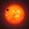 Il pianeta 1214b transita davanti alla sua stella madre (visone d'artista) 